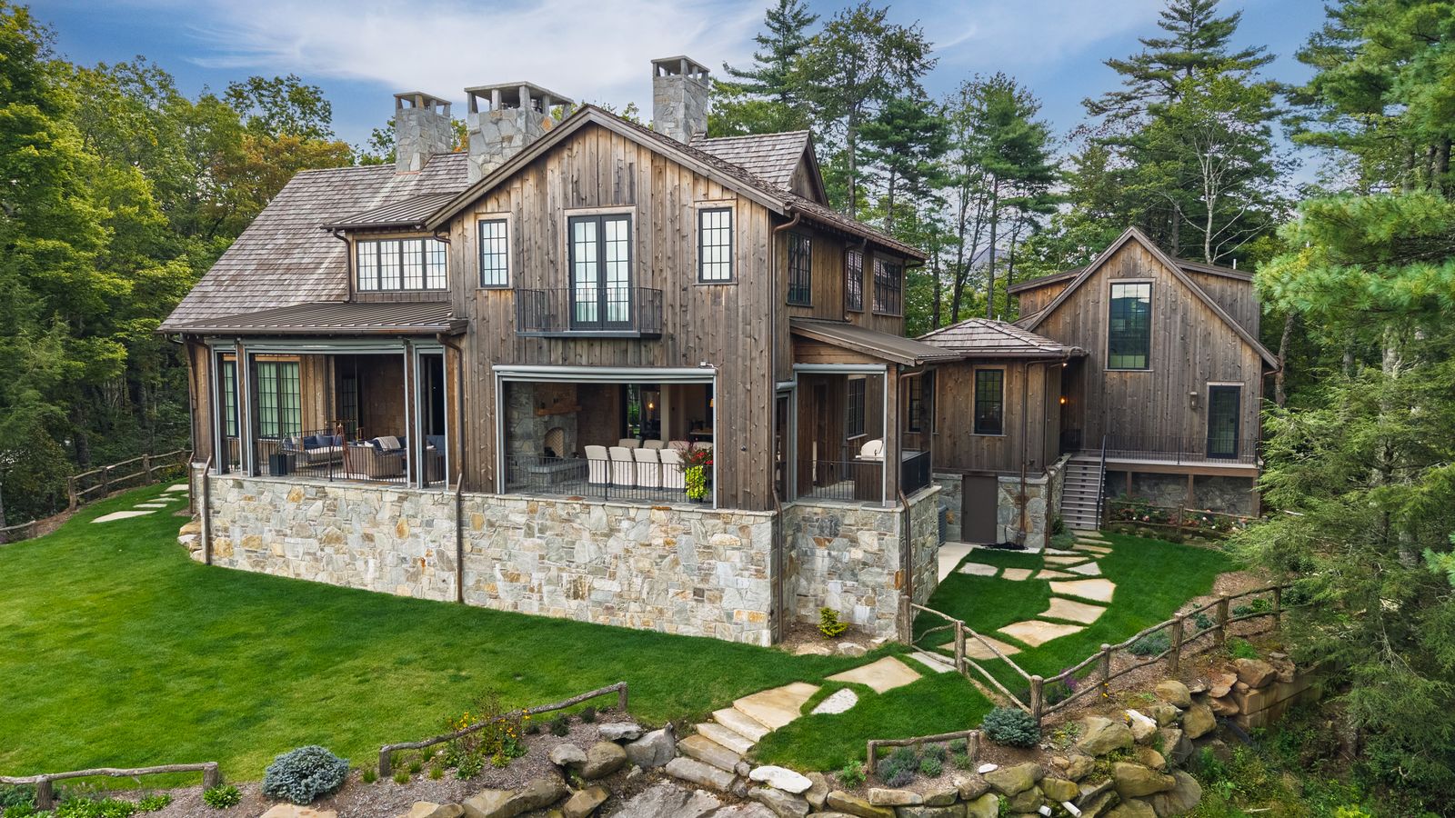 Covered porch and stone terrace, custom mountain home