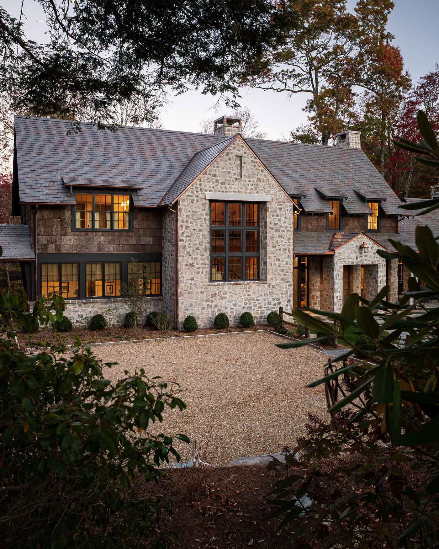 Finished custom home at dusk with the lights on, High Hampton, Cashiers NC